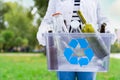Volunteer holding glass garbage container for recycling Royalty Free Stock Photo