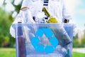 Volunteer holding glass garbage container for recycling Royalty Free Stock Photo