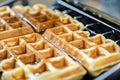 closeup of waffle cooking in iron