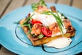 Closeup on waffle toast with poached egg salmon