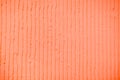 Textured coral background with plaster vertical lines and stripes Royalty Free Stock Photo