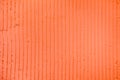 Textured coral background with plaster vertical lines and stripes Royalty Free Stock Photo