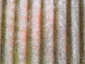 Closeup of the wall with a decorative pink colored plaster vertical lines and stripes Royalty Free Stock Photo