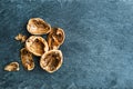 Closeup on walnut shells on stone substrate Royalty Free Stock Photo
