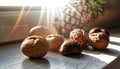 Closeup with walnuts and chestnuts on the windowsill where rays of sunlight shine through