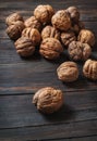 Closeup walnuts on wooden dark table