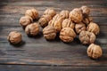 Closeup walnuts on wooden dark table.