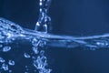 Closeup of water drop splash on water wave surface Royalty Free Stock Photo