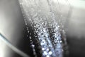 Closeup of water drops falling from the shower head in the bathroom Royalty Free Stock Photo