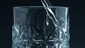 Closeup water pouring glass with splashing dark background. Crystal fresh liquid Royalty Free Stock Photo