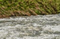 Closeup of surging river after torrential monsoon rains
