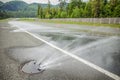 Closeup of water road sprinkler