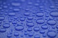 Closeup waterdrops on blue ceramic coated paint surface Royalty Free Stock Photo