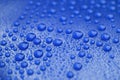 Closeup waterdrops on blue ceramic coated paint surface Royalty Free Stock Photo