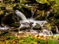 Closeup of waterfall with silky water and rocks in the foreground in the forest in the Great Smoky Mountains National Park. Royalty Free Stock Photo