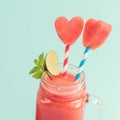Closeup of watermelon smoothie in Mason jar with lime and mint Royalty Free Stock Photo