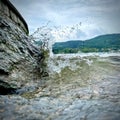 Closeup of a wave crashing against a rock. Royalty Free Stock Photo