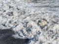 Closeup wave with foam on the beach of the Black Sea beach