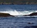 Wave hitting a rock in the ocean making a big splash Royalty Free Stock Photo