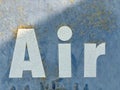 Weathered metal closeup with text Air