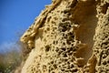 Closeup of the weathering of the globigerina limestone under the sunlight and a blue sky in malta