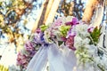 Closeup wedding arch decorated with floral bouquets