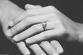 Closeup the wedding beauty diamond ring on women ring finger, B&W filter applied