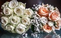 Closeup of a wedding bouquet next to wedding rings on glass Royalty Free Stock Photo