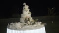 Closeup of wedding cake top with detailed icing. Action. Wedding cake outdoors Royalty Free Stock Photo