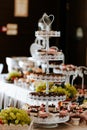 Closeup of a wedding candybar with cakes and fruits