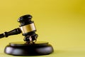 Closeup of wedding rings on wooden mallet at table in courtroom Royalty Free Stock Photo