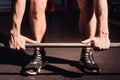 Closeup of weightlifter clapping hands before barbell workout at the gym Royalty Free Stock Photo