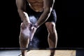 Closeup of weightlifter clapping hands before barbell workout at Royalty Free Stock Photo