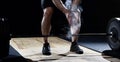 Closeup of weightlifter clapping hands before barbell workout at Royalty Free Stock Photo