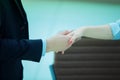 Closeup .welcoming handshake of a businessman and business woman Royalty Free Stock Photo