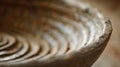 A closeup of a wheelthrown bowl reveals a subtle texture created by the potters fingers as they shape the clay.