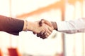 Closeup of White and Black shaking hands over a deal Royalty Free Stock Photo