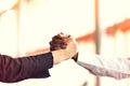 Closeup of White and Black shaking hands over a deal Royalty Free Stock Photo