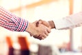 Closeup of White and Black shaking hands over a deal Royalty Free Stock Photo