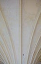 Closeup white ceiling supported by old columns. Architectural part Royalty Free Stock Photo