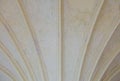 Closeup white ceiling supported by old columns. Architectural part