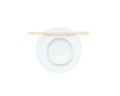 Closeup white ceramic chalice on circle dish wood chopsticks isolated on white background Royalty Free Stock Photo