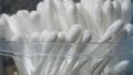 Closeup of white cotton bud or cotton swab in crack plastic cont Royalty Free Stock Photo