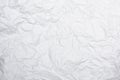 Closeup white crumpled paper texture background White wrinkled paper texture background White crease fabric texture background.