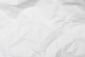 Closeup white crumpled paper texture background White wrinkled paper texture background White crease fabric texture background.