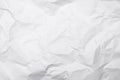 Closeup white crumpled paper texture background White wrinkled paper texture background White crease fabric texture background.