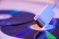Closeup of white HDMI cable with it`s reflection on blank disc Royalty Free Stock Photo