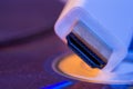 Closeup of white HDMI cable with it`s reflection on blank disc Royalty Free Stock Photo