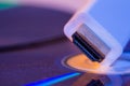 Closeup of white HDMI cable with it`s reflection on blank disc Royalty Free Stock Photo