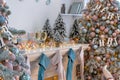 Closeup of white living room with big windows and Christmas New year decor,light garland and champagne glass